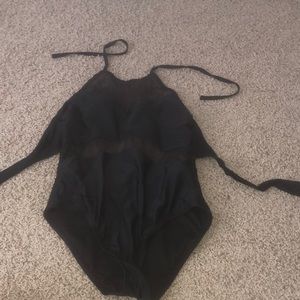 A black 1 piece swimming suit